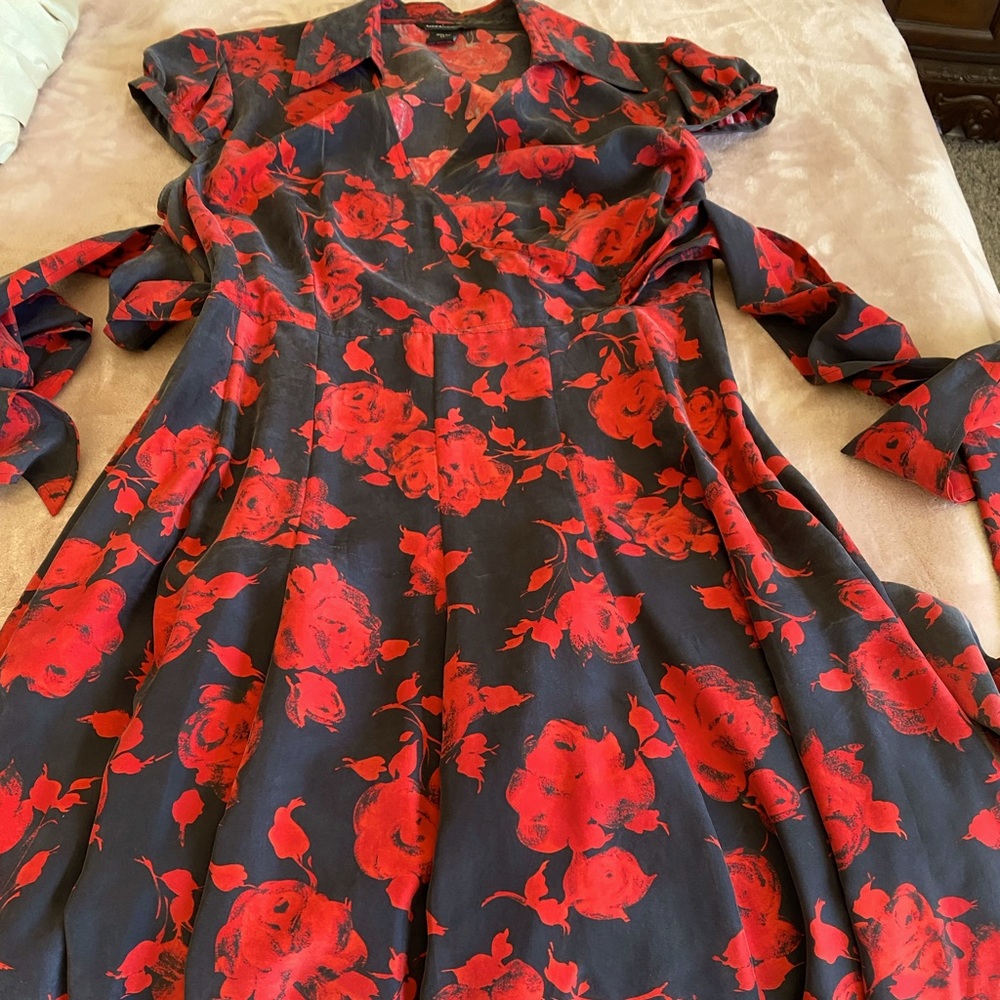 Beautiful silk dress with red roses on black background
